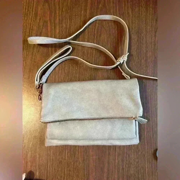 Grey Fold over Purse. Wristlet Strap. Shoulder Strap. Pockets. Zipper. Snap. - Picture 1 of 7